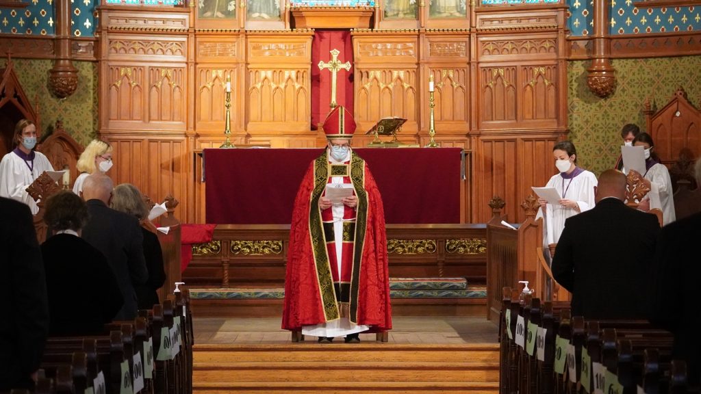 Bishop standing at front of church